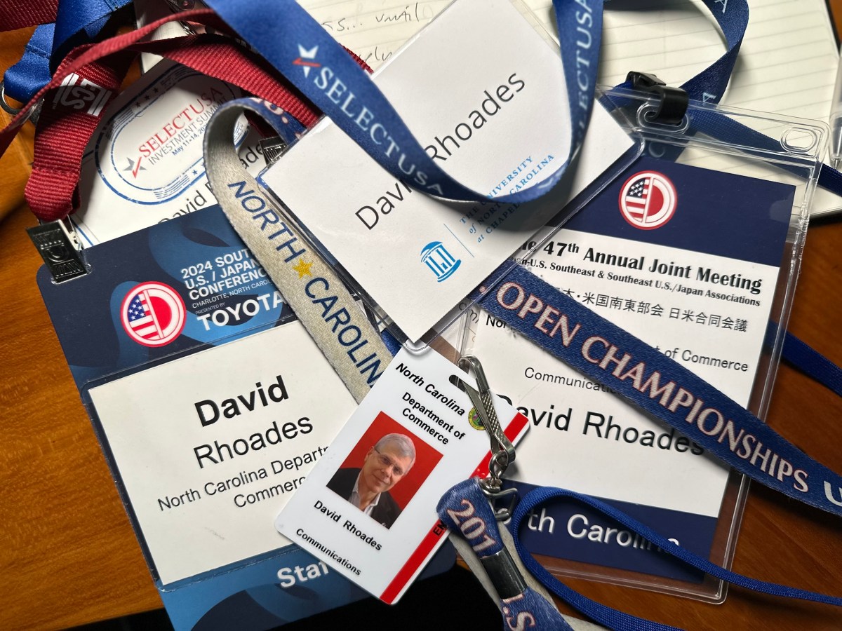Trade show badges including two from the Southeast U.S./Japan Conference
