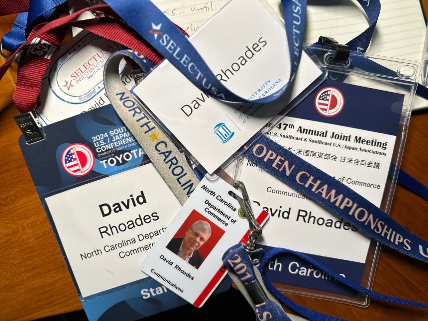 Trade show badges including two from the Southeast U.S./Japan Conference